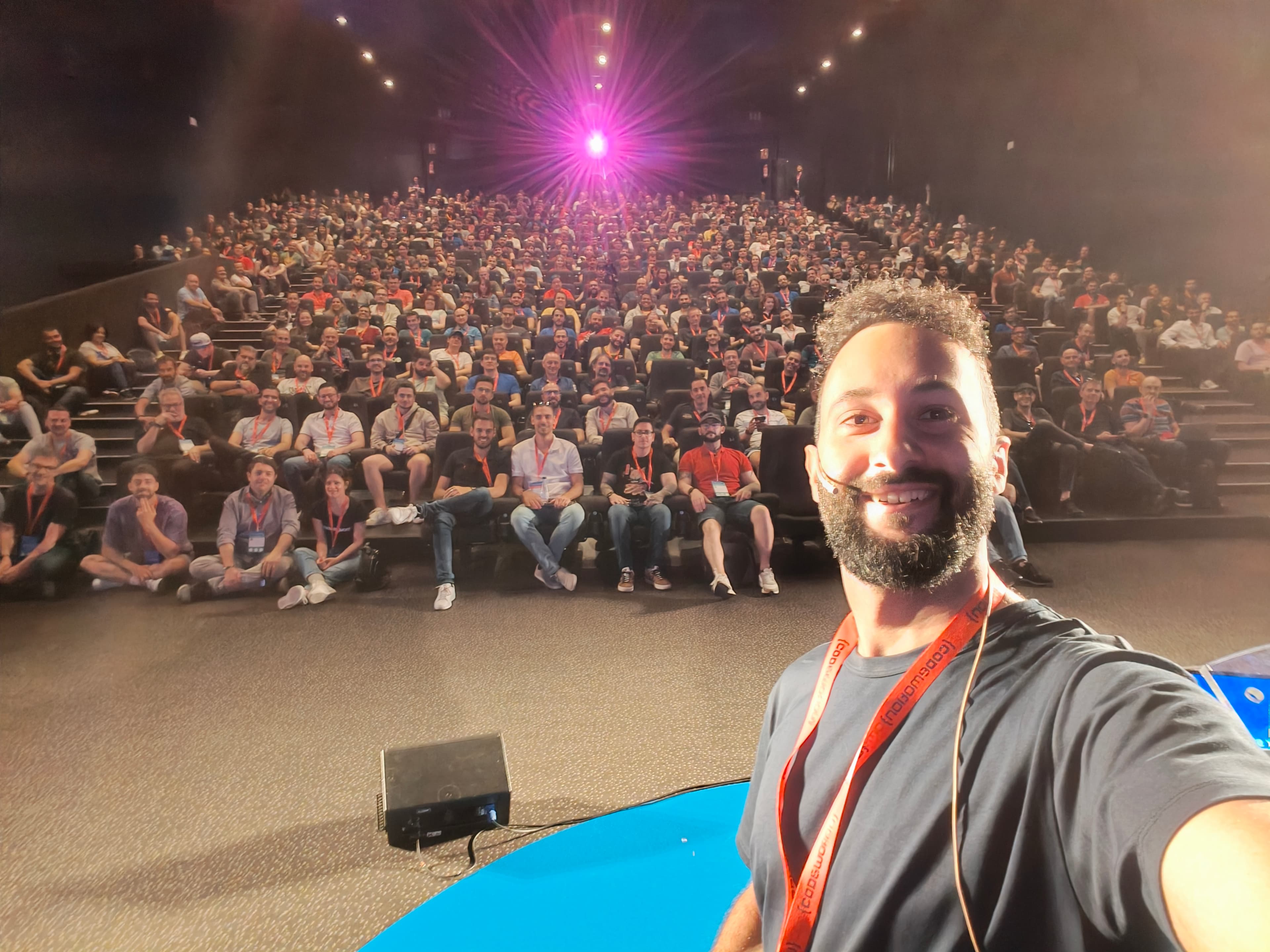 César giving a talk on stage